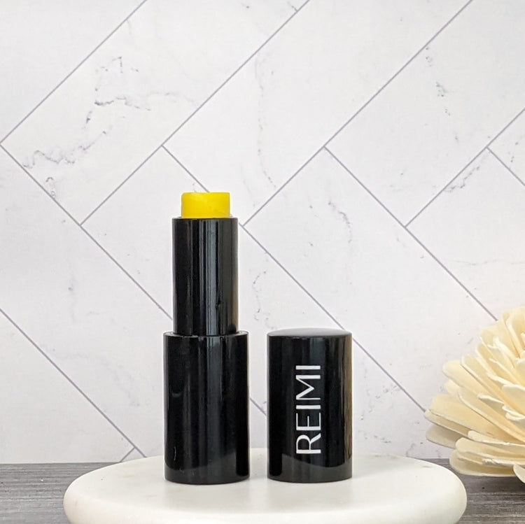 .17 oz White lip balm stick with text, REIMI Botanicals Lip Nourishing Stick, Cardamom"