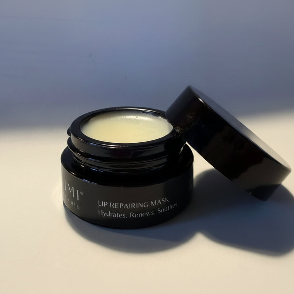 Black lip repairing mask jar with open lid on a light surface