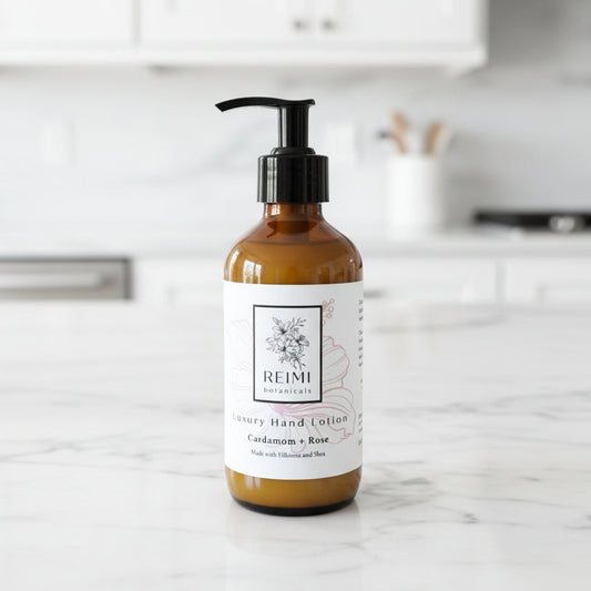 Brown bottle of Reimi hand lotion on a marble countertop