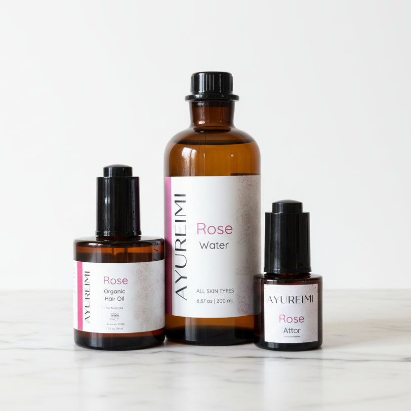 AYUREIMI Rose Sensory Hair Ritual with three products in amber glass with black closures.