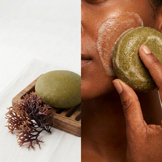 A round olive-green stone soap dish or soap bar resting on a small carved wooden tray against a plain light gray background.