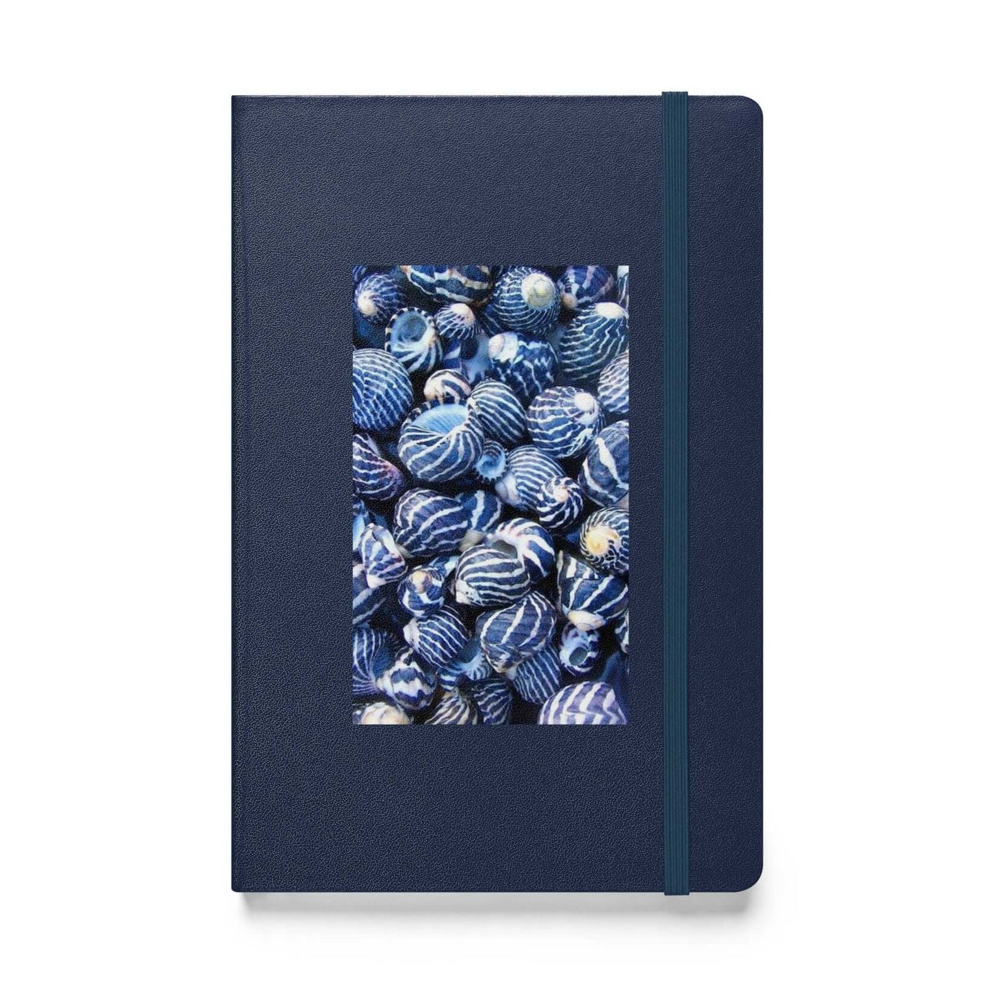Navy blue notebook with a patterned cover on a white background